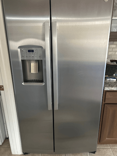 Refrigerator needing repair in Peoria.